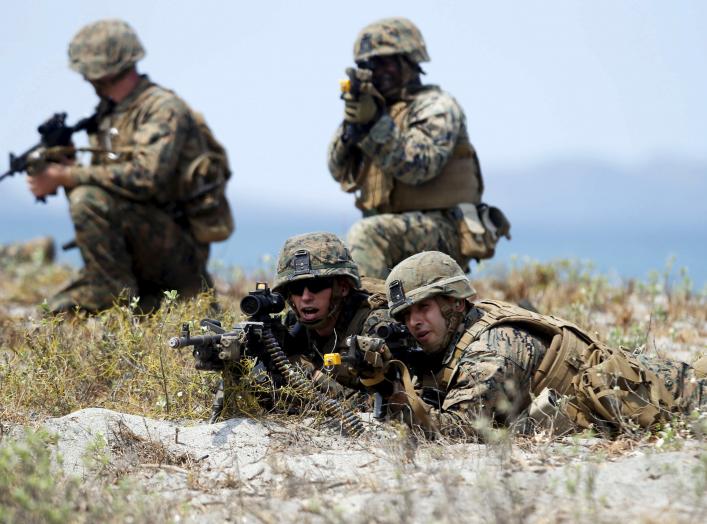 U.S. military forces take up positions during the annual "Balikatan" (shoulder-to-shoulder) war games with Filipino soldiers at the shore of San Antonio, Zambales in northern Philippines.